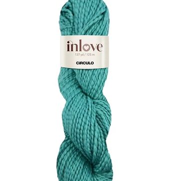 A green skein of cotton yarn called Inlove from Circulo Yarn.