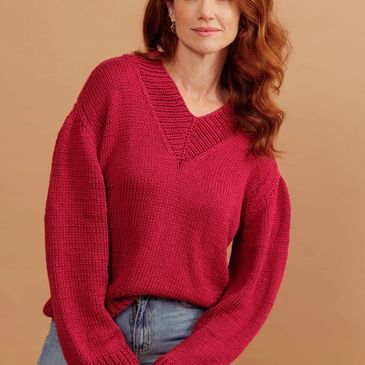 A red sweater knit with Aloe Vera yarn from Circulo Yarn.