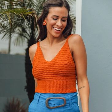 An orange top knit with Ann a mercerized cotton from Circulo Yarn.