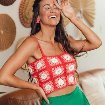 A red and white crochet top made with Clea from Circulo Yarn.