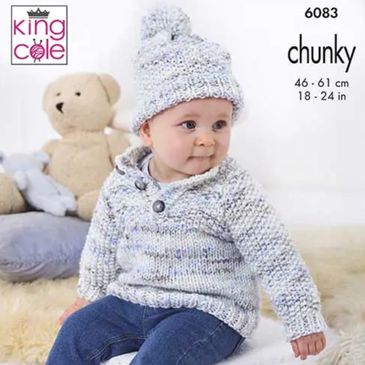 A toddler wearing a sweater knit out of Bumble Chunky from King Cole Yarn.