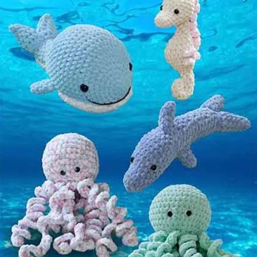 A whale, octopus, dolphin and shark knit and crocheted out of Yummy yarn from King Cole.