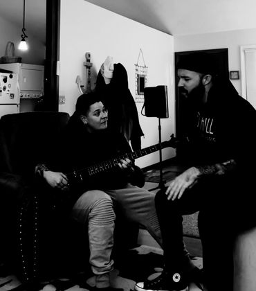 mavelle playing the bass and michael spellman singing