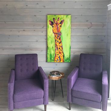 View from lavender farm casitas. Two purpose chairs and hand painted giraffe painting.