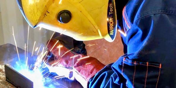 Welding student practicing Mig Welding .