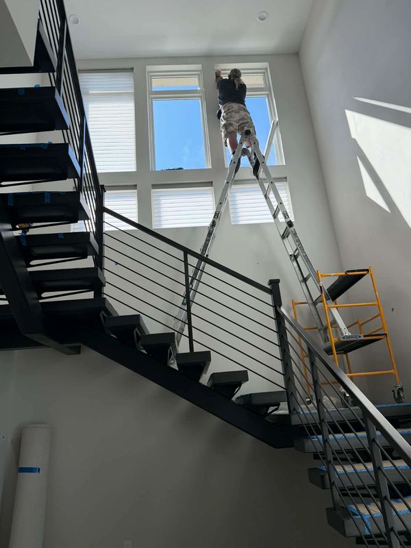 Installing sheer shadings on a 15 ft stiarwell in Summerlin, NV