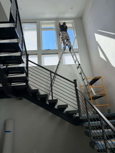 Installing sheer shadings on a 15 ft stiarwell in Summerlin, NV