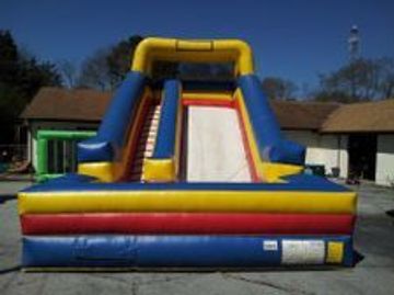 24' tall inflatable slide rental with detachable pool, featuring primary colors.