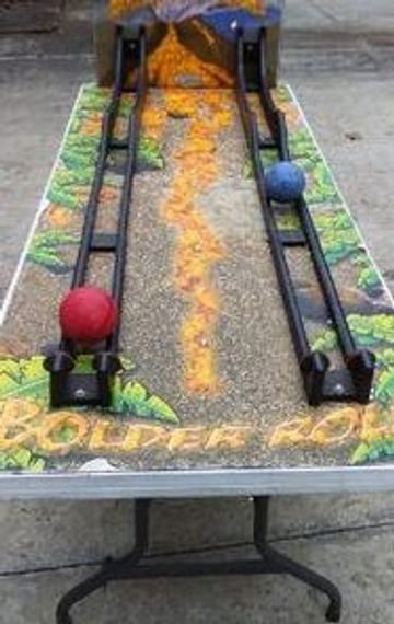 Roller Bowler carnival game. Bounce house rental fun. Great for school festivals.