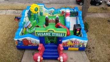 Colorful Sesame Street inflatable toddler playland bounce house rental. For kids 5 & under.
