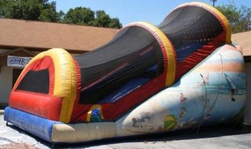 Massive 22 foot covered inflatable slide bounce house rental.