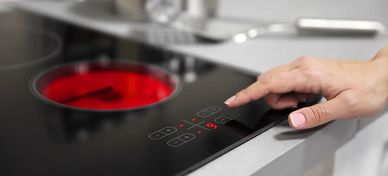 an electric counter top hob with a red ring