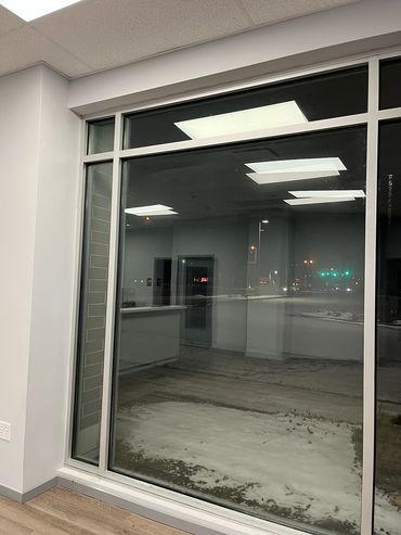 Large commercial office window cleaned by professional cleaning service in McHenry County IL.