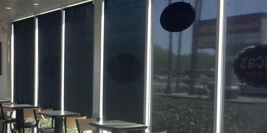 Solar Shades in windows of a restaurant.  Commercial window treatments in Omaha & beyond