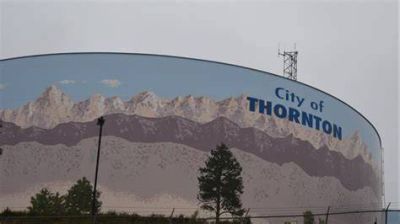 Water tower in Thornton with mountain mural.
