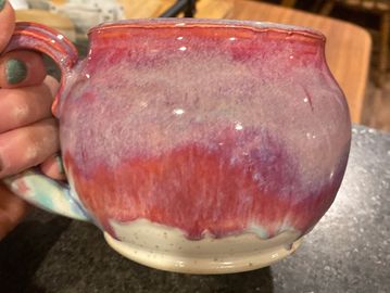 Large 20 ounce mug. Lovely pink drippy glazes. Great for morning coffee or soup. Inside is white wit