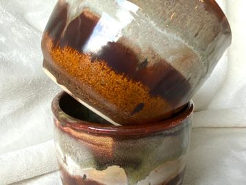 Set of two cups. Layers of drippy brown glazes.
Holds 10 ounces.