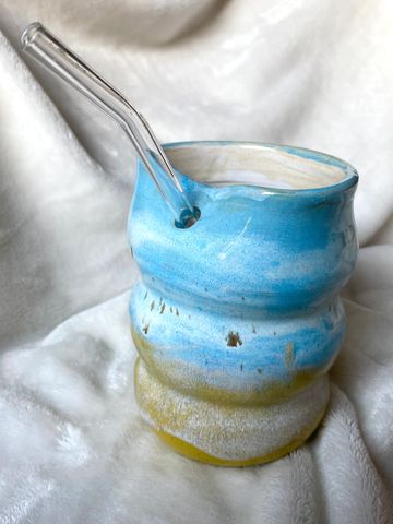 Handcrafted Bubble mug with speckled blue and yellow glazes. White glaze inside. Holds 14 ounces. Co