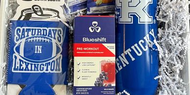 Gift box with Kentucky-themed drinkware, snacks, and pre-workout supplement. Curated college and sorority gift set from North Meets South.