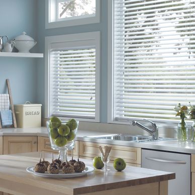 2" Venetian blinds. Horizontal design. Fauxwood, real wood slats. Kitchen. Soft blue colours. 