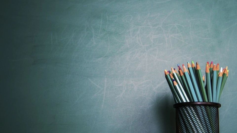 Blackboard with Pencils.  TEACHERS COUNCIL. THOMASINO MEDIA LLC 