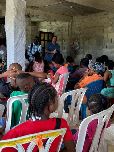 Dewayne preaching to a group of unbelievers