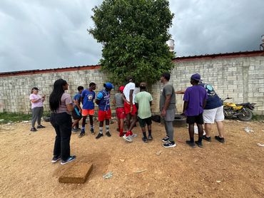 A group of kids hearing about Jesus