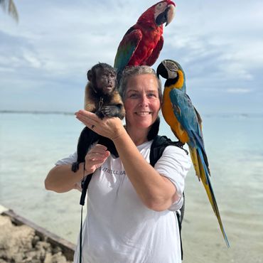 Kim and a monkey and two parrots
