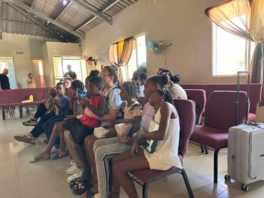 Group of children learning about Jesus