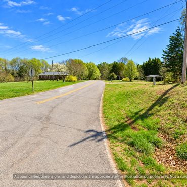 Paved Hywood Rd at the east edge of wooded land near Casar NC