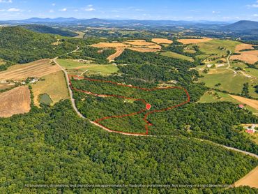 Creekfront wooded acreage on a paved road near Saxapahaw NC, boundary approximate