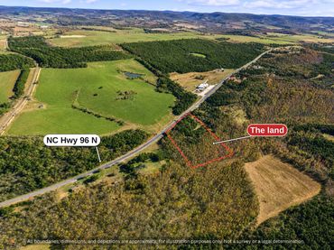 Wide aerial of rolling Granville County farmland and woods around the land on NC Hwy 96
