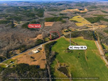 Aerial showing the land along NC Hwy 96 with open pasture across the highway