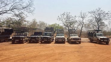 Safari trucks in Mole National Park, waiting to whisk you away on an adventure.
