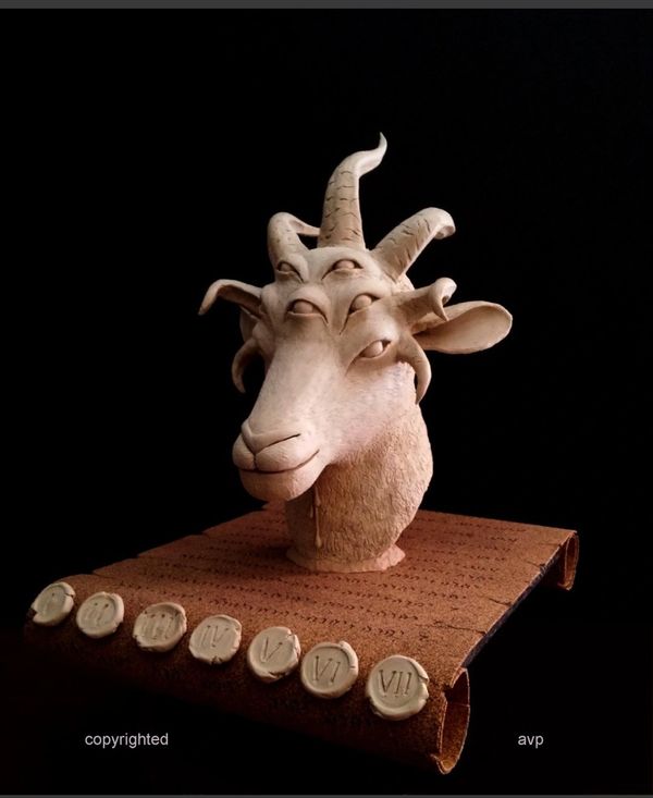 sculpture, plaster cast of lambs head on a scroll with 7 horns, 7 eyes and 7 seals, side view