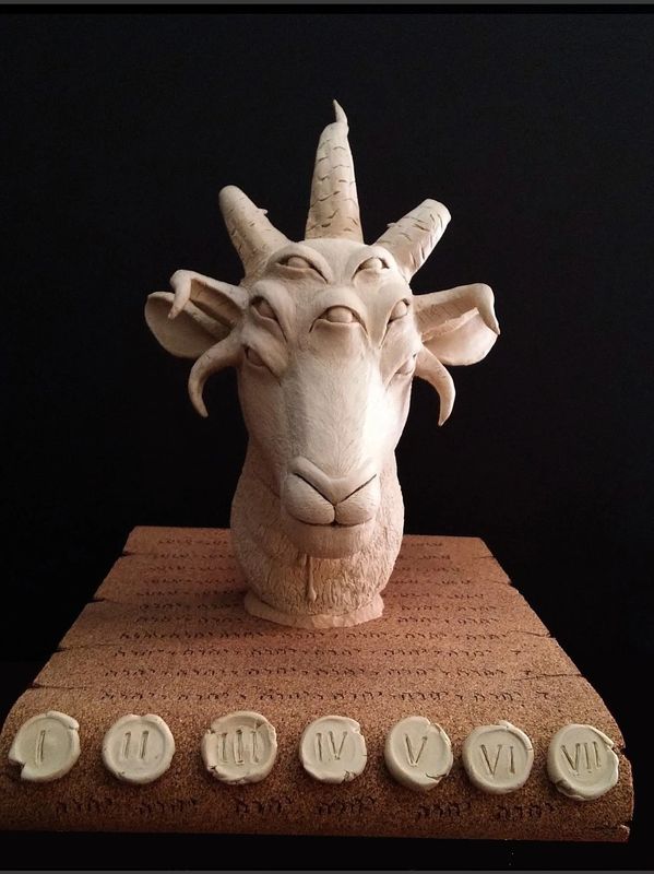 sculpture, plaster cast of lamb head and scroll with 7 horns, 7 eyes and 7 seals