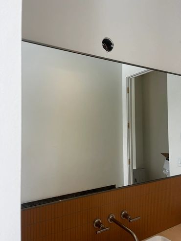 Wall to wall custom mirror installed by Precision Glass for a Bigfork MT custom home builder