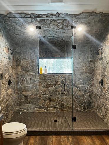 Custom glass shower enclosure with custom shower hardware for a Precision Glass customer in Bigfork