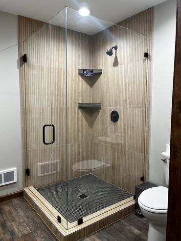 A basement custom glass shower enclosure installed for a Bigfork client of Precision Glass