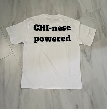 White T-shirt with bold black text reading 'CHI-nese powered' on the back.