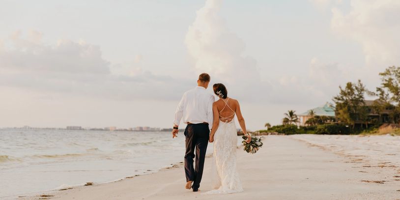 Romantic wedding picture on a tropical beach - destination wedding planner Ali Mohamed