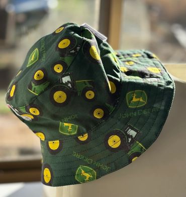Green John Deere bucket hat with tractor print.