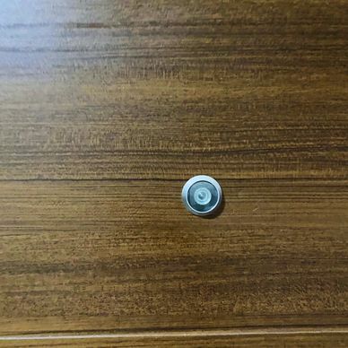 Peep hole on the door to check oncoming guests without need to open the door for security layer