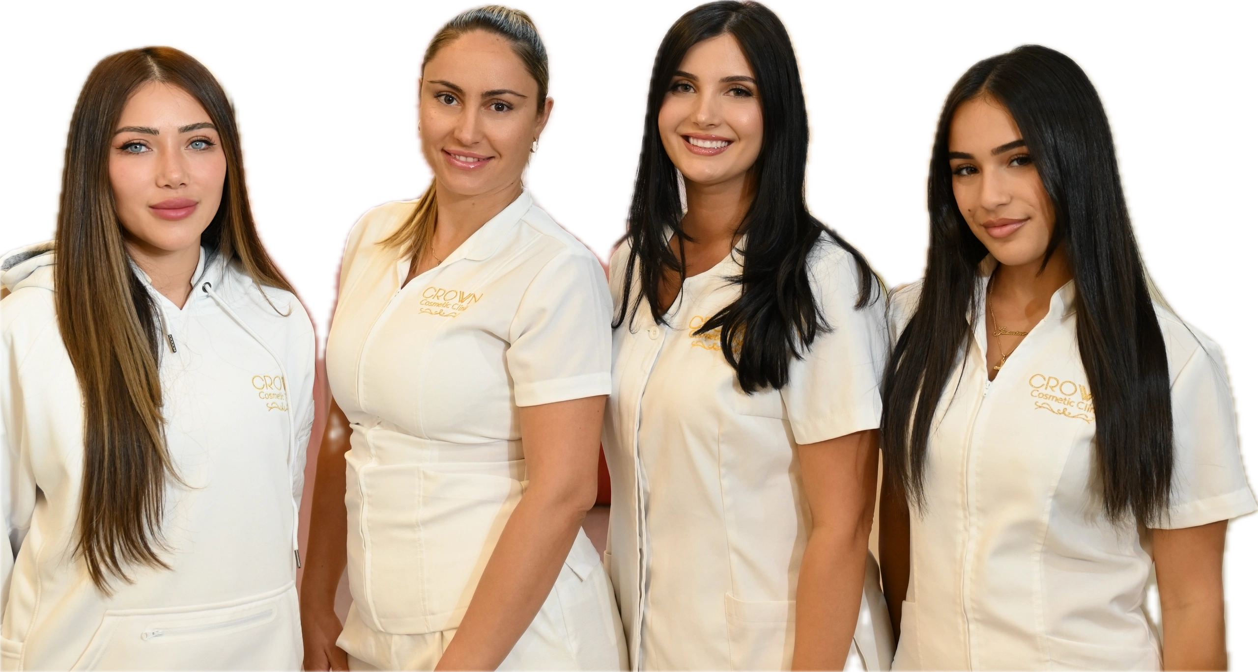 Four women in white uniforms smiling at the camera.