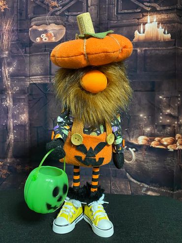 Fall 2026 Pumpkin Pants with green jack o' lantern.