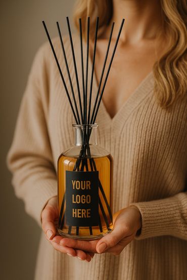 Luxury private label reed diffuser in glass bottle with wooden sticks.