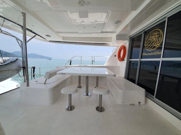 Spacious Dining Table on Lady Alia Langkawi Luxurious Private Yacht for Luxurious Langkawi Cruise