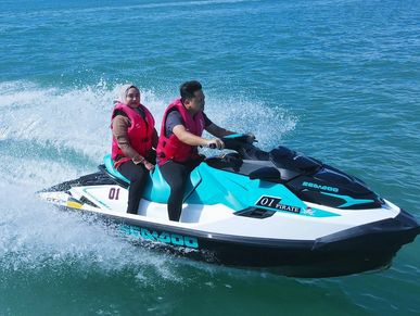 A Malay couple riding a jetski on Langkawi water