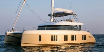 Luxury catamaran yacht on calm waters at sunset