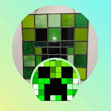 Stained glass art depicting a green Creeper from Minecraft.